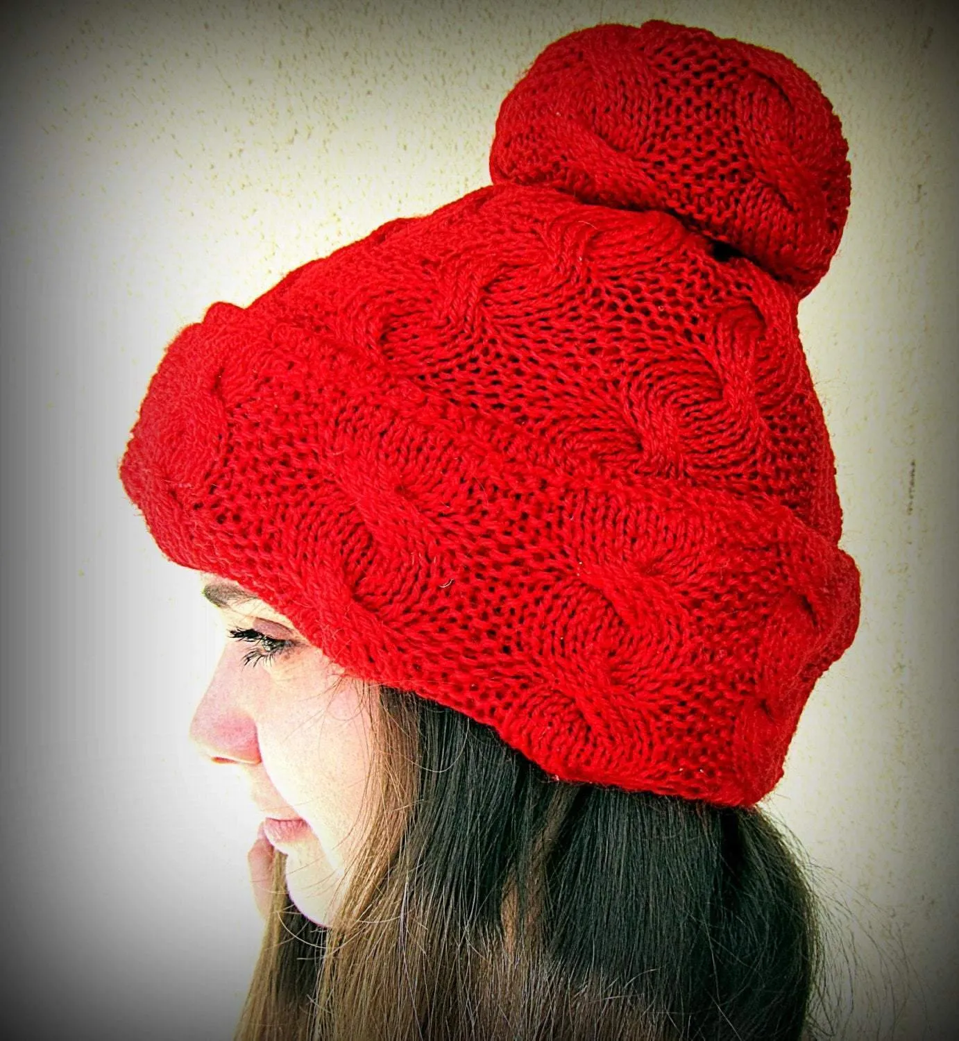Knitted red set: a pom-pom cap and fingerless gloves/gaiters