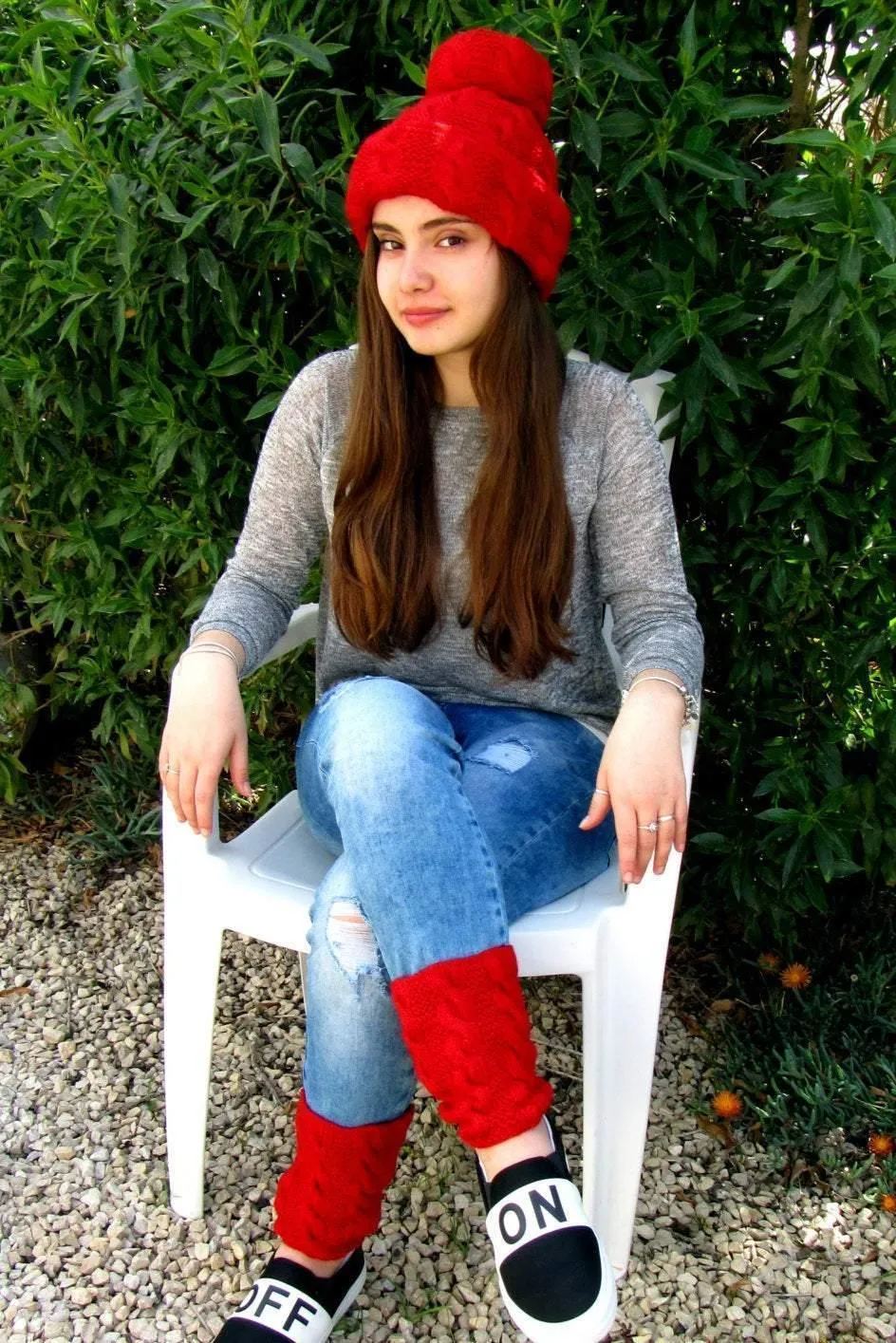Knitted red set: a pom-pom cap and fingerless gloves/gaiters